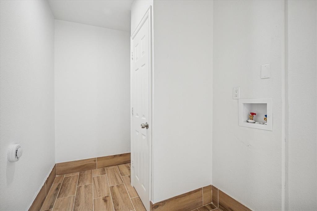1809 Dunning Street Irving, TX 75061 - Photo 28 of 35 a view of a hallway with wooden floor