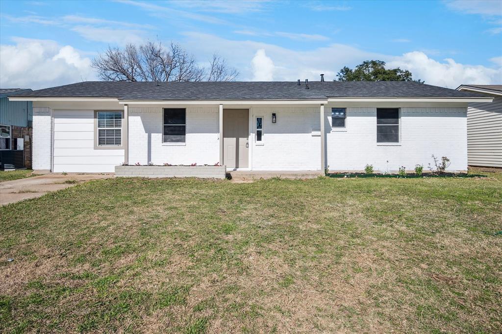 1809 Dunning Street Irving, TX 75061 - Photo 30 of 35 a big house with a big yard and large trees