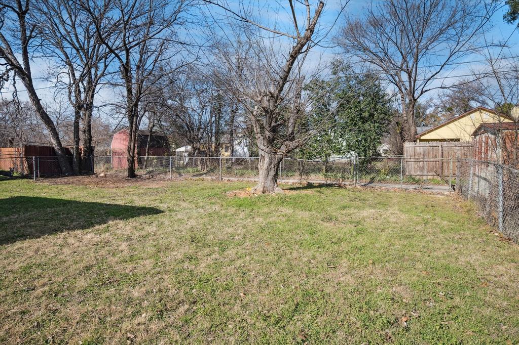 1809 Dunning Street Irving, TX 75061 - Photo 34 of 35 a view of a tree in front of a house