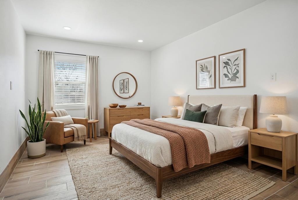 1809 Dunning Street Irving, TX 75061 - Photo 8 of 35 a bedroom with a large bed and potted plant