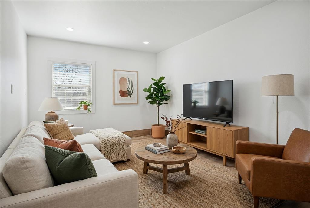 1809 Dunning Street Irving, TX 75061 - Photo 9 of 35 a living room with furniture and a flat screen tv