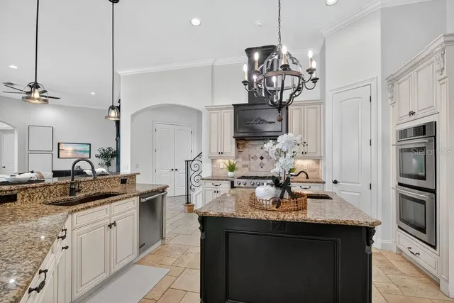 a kitchen with a counter space cabinets and appliances