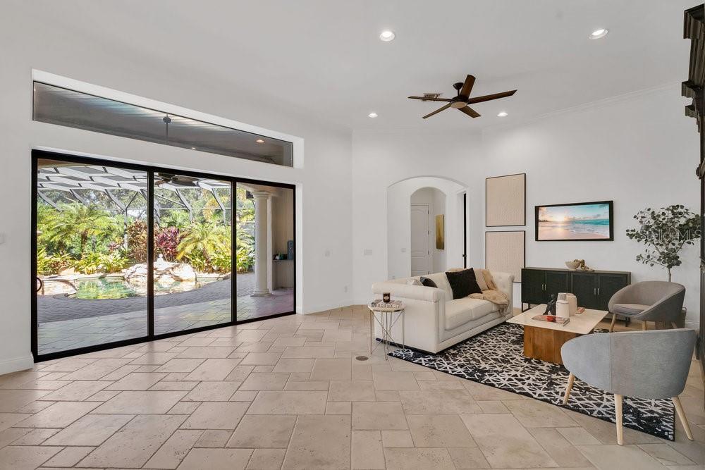 9204 Tibet Pointe Circle Windermere, FL 34786 - Photo 17 of 72 a living room with furniture and a large window