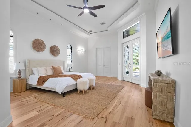 a bathroom with a double vanity sink a mirror and a bathtub