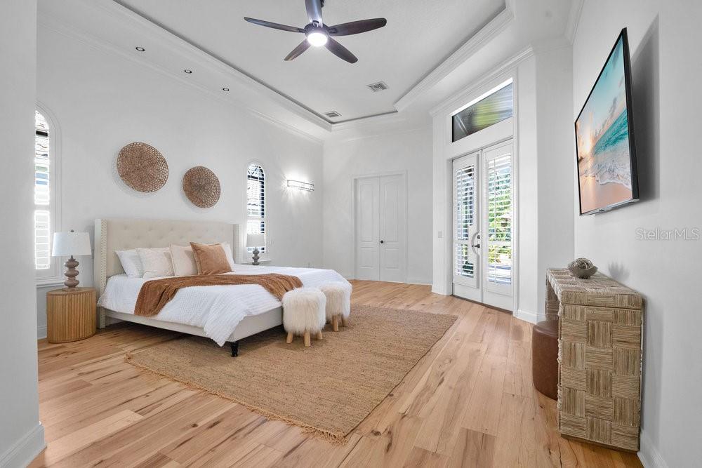 9204 Tibet Pointe Circle Windermere, FL 34786 - Photo 18 of 72 a spacious bedroom with a bed and window