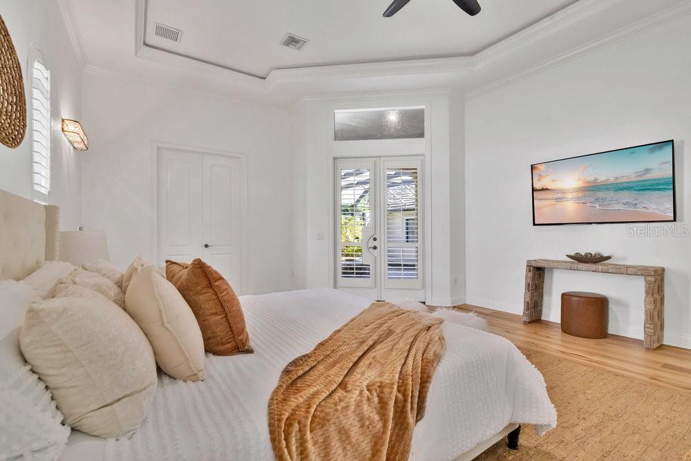 9204 Tibet Pointe Circle Windermere, FL 34786 - Photo 19 of 72 a bedroom with a bed and a fireplace