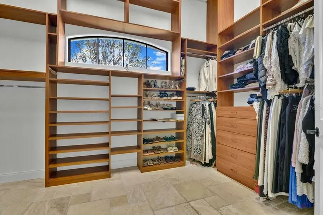 a utility room with cabinets and wooden floor