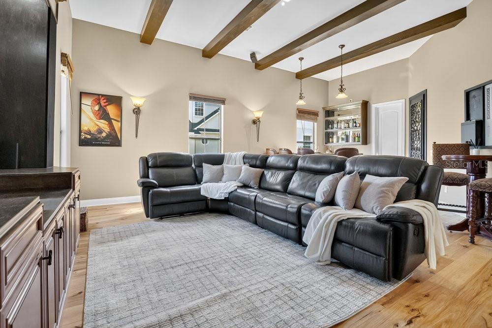 9204 Tibet Pointe Circle Windermere, FL 34786 - Photo 30 of 72 a living room with furniture and a flat screen tv