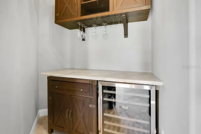 a view of a backyard with plants and a patio