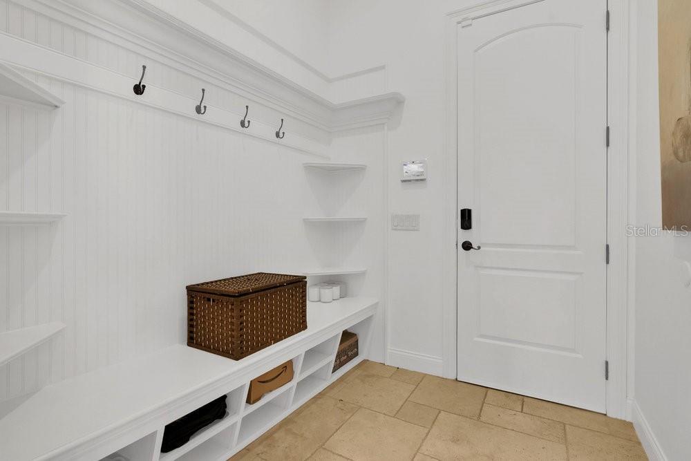 9204 Tibet Pointe Circle Windermere, FL 34786 - Photo 34 of 72 a utility room with cabinets and wooden floor