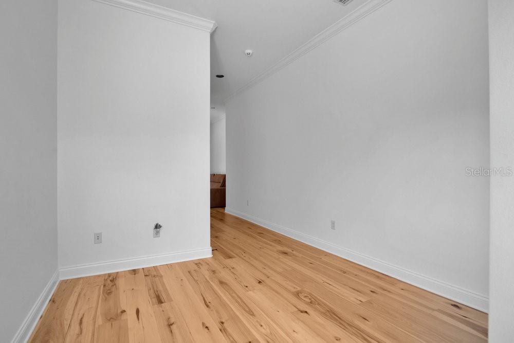 9204 Tibet Pointe Circle Windermere, FL 34786 - Photo 35 of 72 a view of an empty room with wooden floor