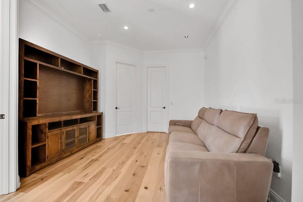 9204 Tibet Pointe Circle Windermere, FL 34786 - Photo 36 of 72 a living room with furniture and a flat screen tv