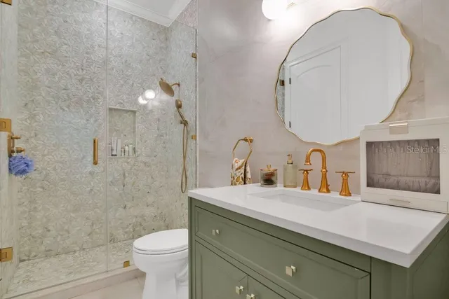 a front view of a house with yard and green space