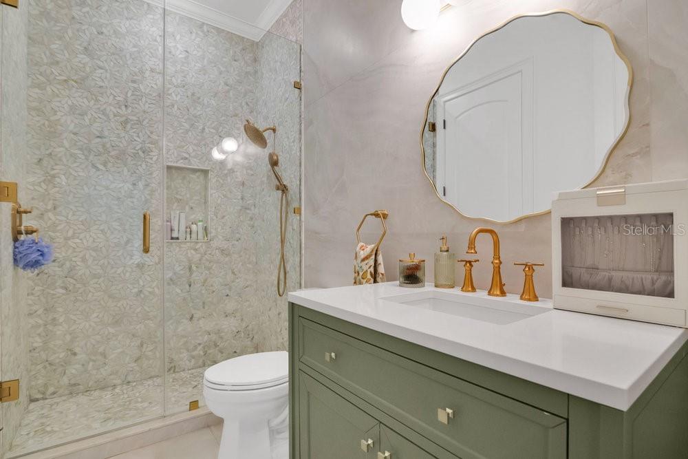 9204 Tibet Pointe Circle Windermere, FL 34786 - Photo 38 of 72 a bathroom with a sink a toilet and a mirror