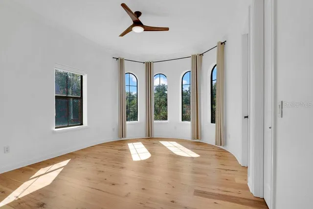 an aerial view of residential houses with outdoor space and lake view