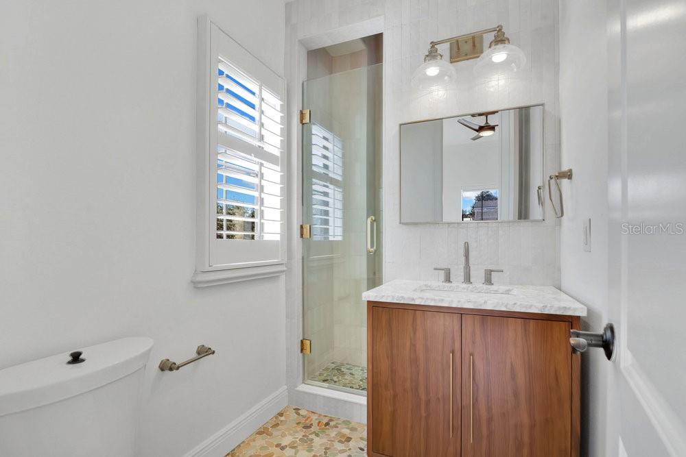 9204 Tibet Pointe Circle Windermere, FL 34786 - Photo 40 of 72 a bathroom with a sink and a mirror