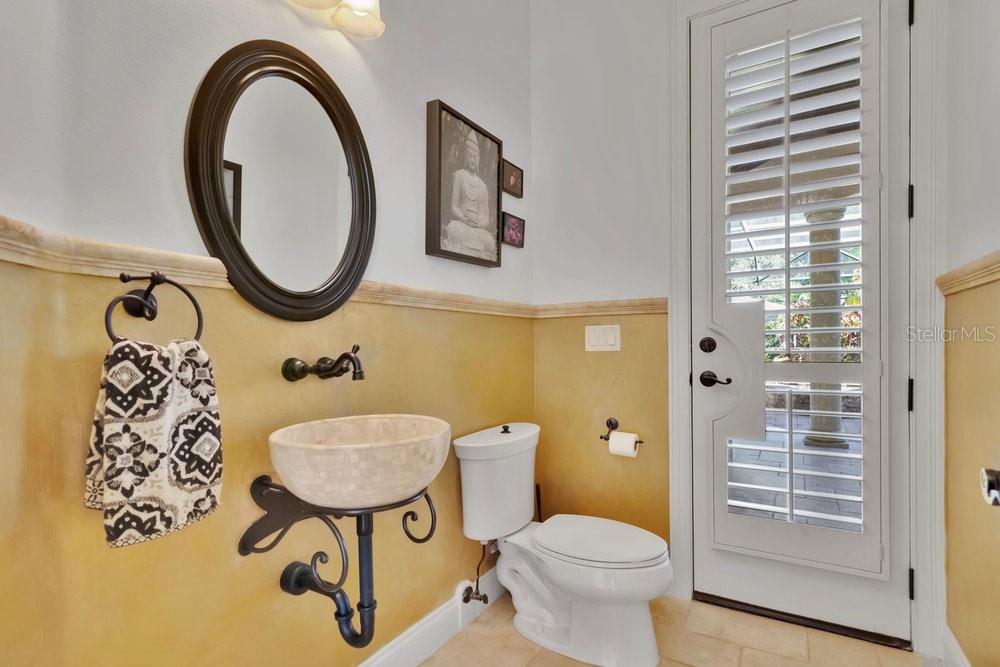 9204 Tibet Pointe Circle Windermere, FL 34786 - Photo 44 of 72 a bathroom with a toilet a sink and a mirror