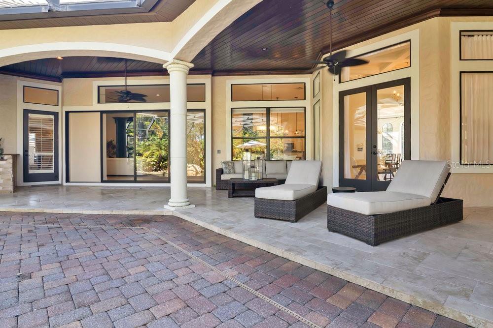 9204 Tibet Pointe Circle Windermere, FL 34786 - Photo 46 of 72 a living room with furniture and large windows