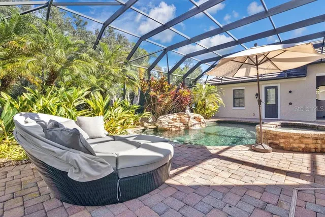 a view of a swimming pool with a yard