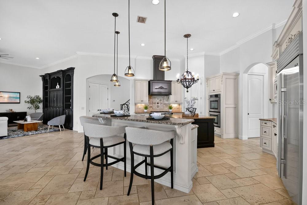 9204 Tibet Pointe Circle Windermere, FL 34786 - Photo 10 of 72 a kitchen with stainless steel appliances a sink stove and refrigerator