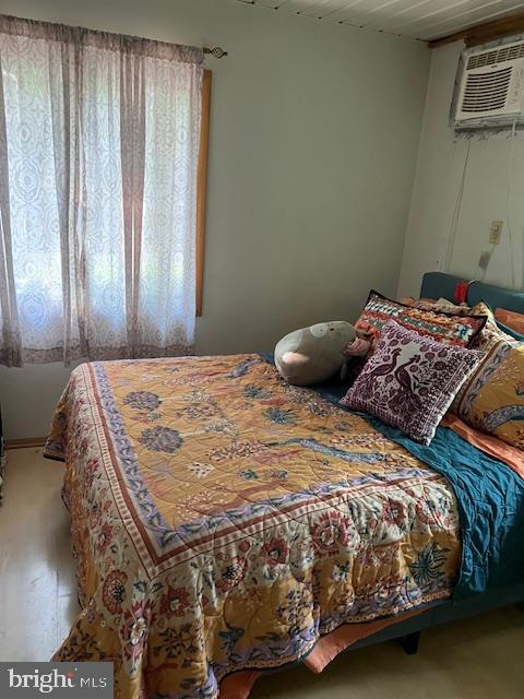 37686 Holly Street Ocean View, DE 19970 - Photo 5 of 10 a bedroom with a bed and painting on the wall