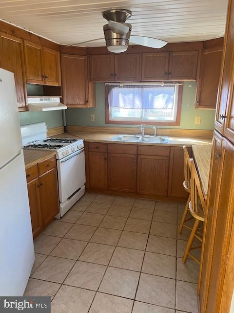 37686 Holly Street Ocean View, DE 19970 - Photo 5 of 11 a kitchen with stainless steel appliances granite countertop a sink and a stove