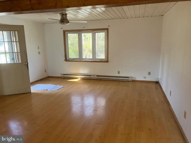37686 Holly Street Ocean View, DE 19970 - Photo 6 of 11 an empty room with wooden floor and windows