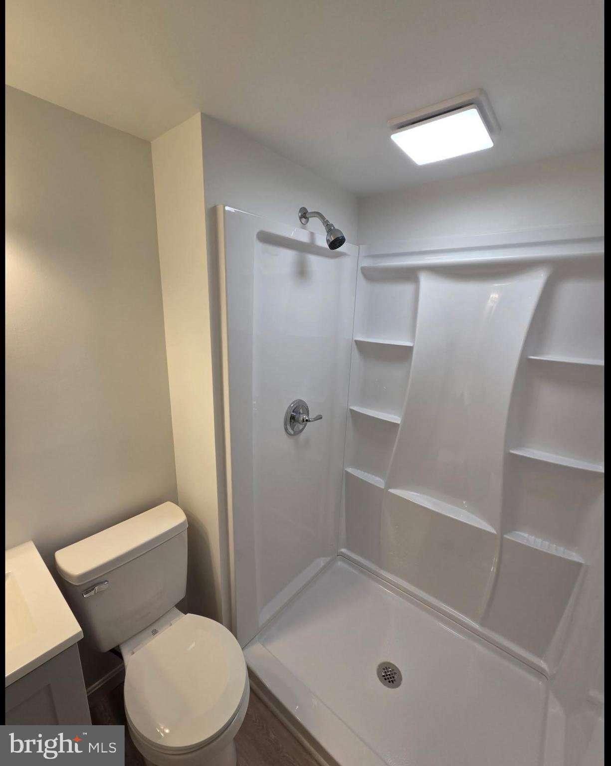 37686 Holly Street Ocean View, DE 19970 - Photo 7 of 10 a bathroom with a shower a toilet and a sink