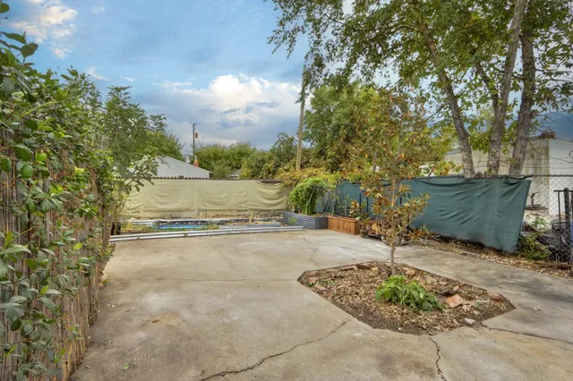 a view of a pathway with a wooden fence