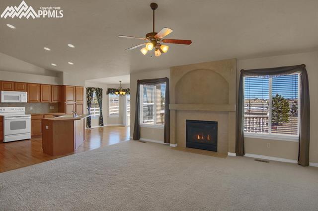 9162 Rockingham Drive Peyton, CO 80831 - Photo 10 of 35 Great room opens to kitchen for convenience.