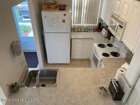 a bathroom with a sink a mirror and shower