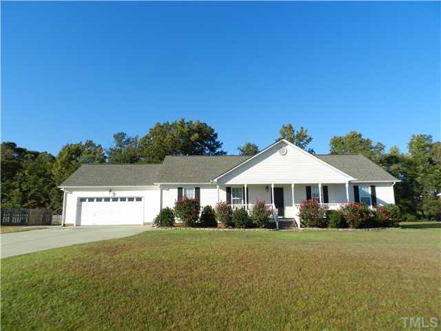 174 Roping Horn Way Willow Spring, NC 27592 - Photo 1 of 15 a front view of a house with a yard