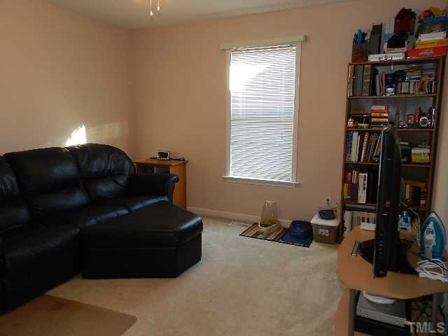 174 Roping Horn Way Willow Spring, NC 27592 - Photo 10 of 15 a living room with furniture and a window