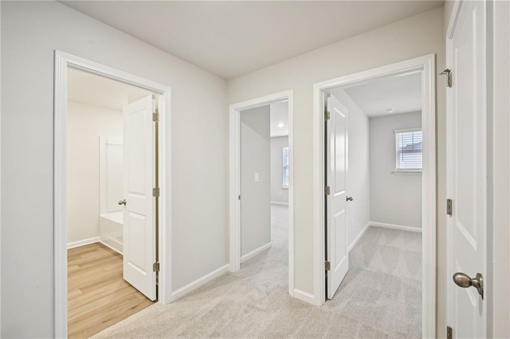 1408 High Fls Lane Grayson, GA 30017 - Photo 27 of 48 wooden floor with white walls
