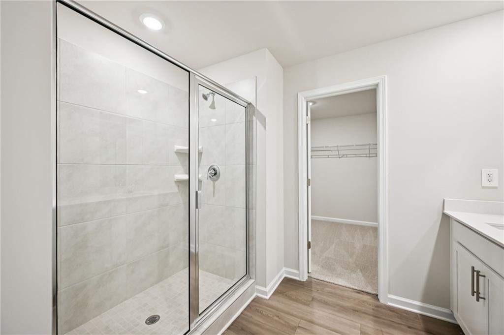 1408 High Fls Lane Grayson, GA 30017 - Photo 44 of 48 a bathroom with a glass shower door