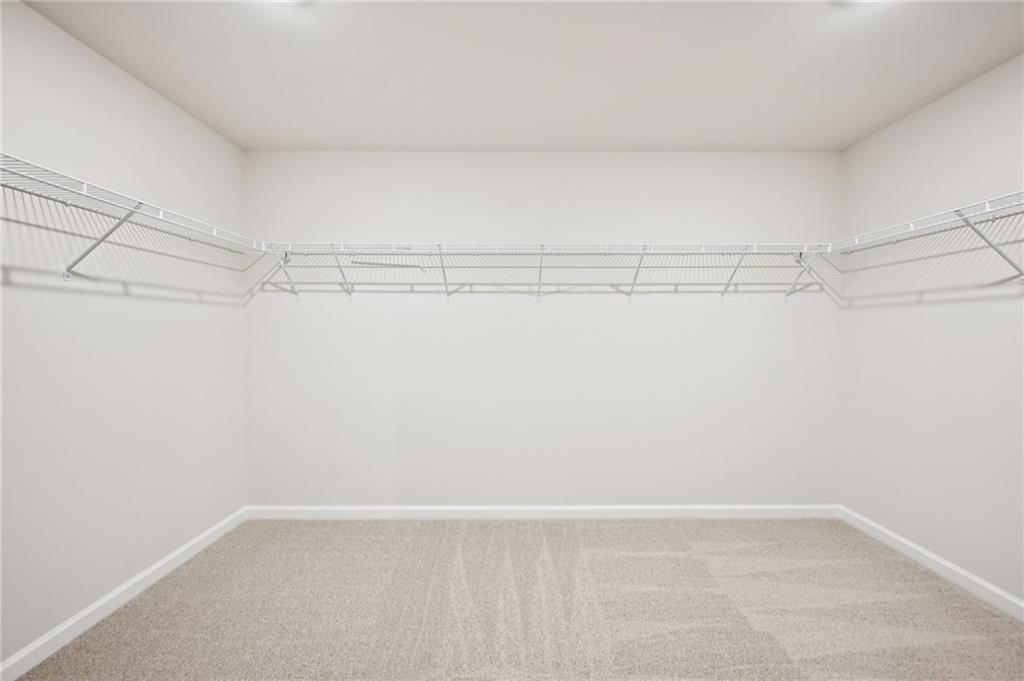 1408 High Fls Lane Grayson, GA 30017 - Photo 45 of 48 a view of a room with racks on the wall