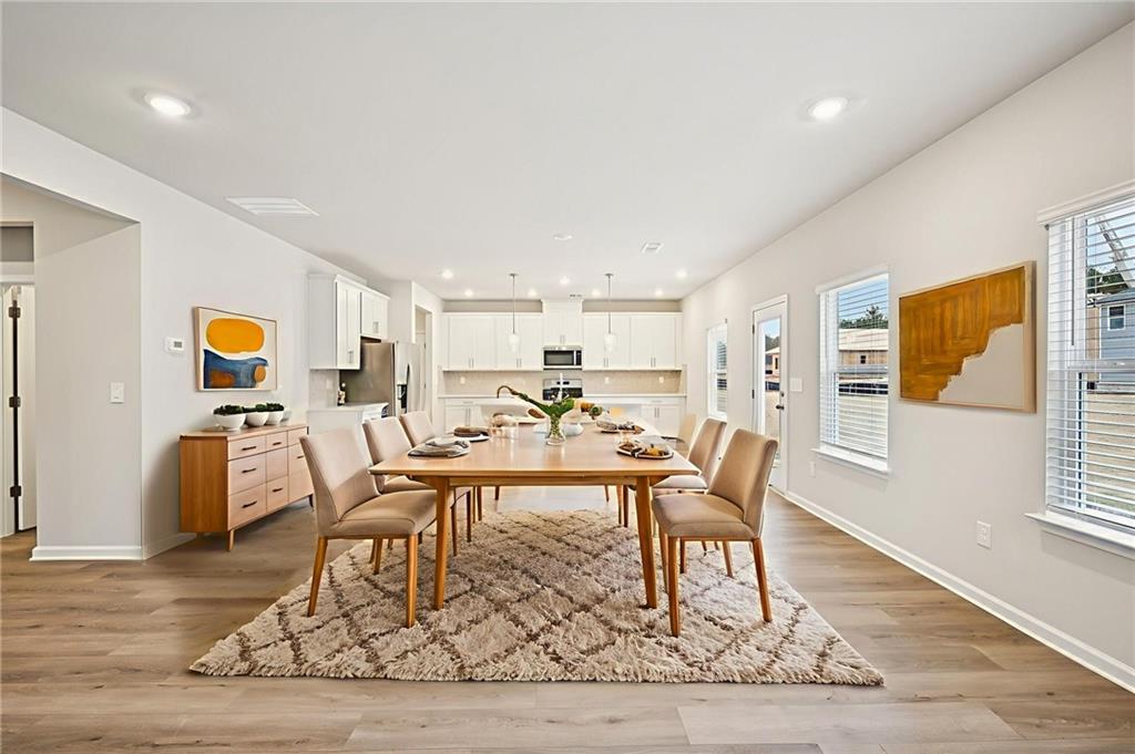 1408 High Fls Lane Grayson, GA 30017 - Photo 8 of 48 a work room with furniture and wooden floor