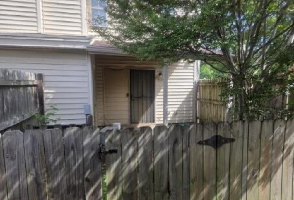 5573 Pleasant View Road, Unit 35 Memphis, TN 38134 - Photo 2 of 6 a view of a house with a wooden fence