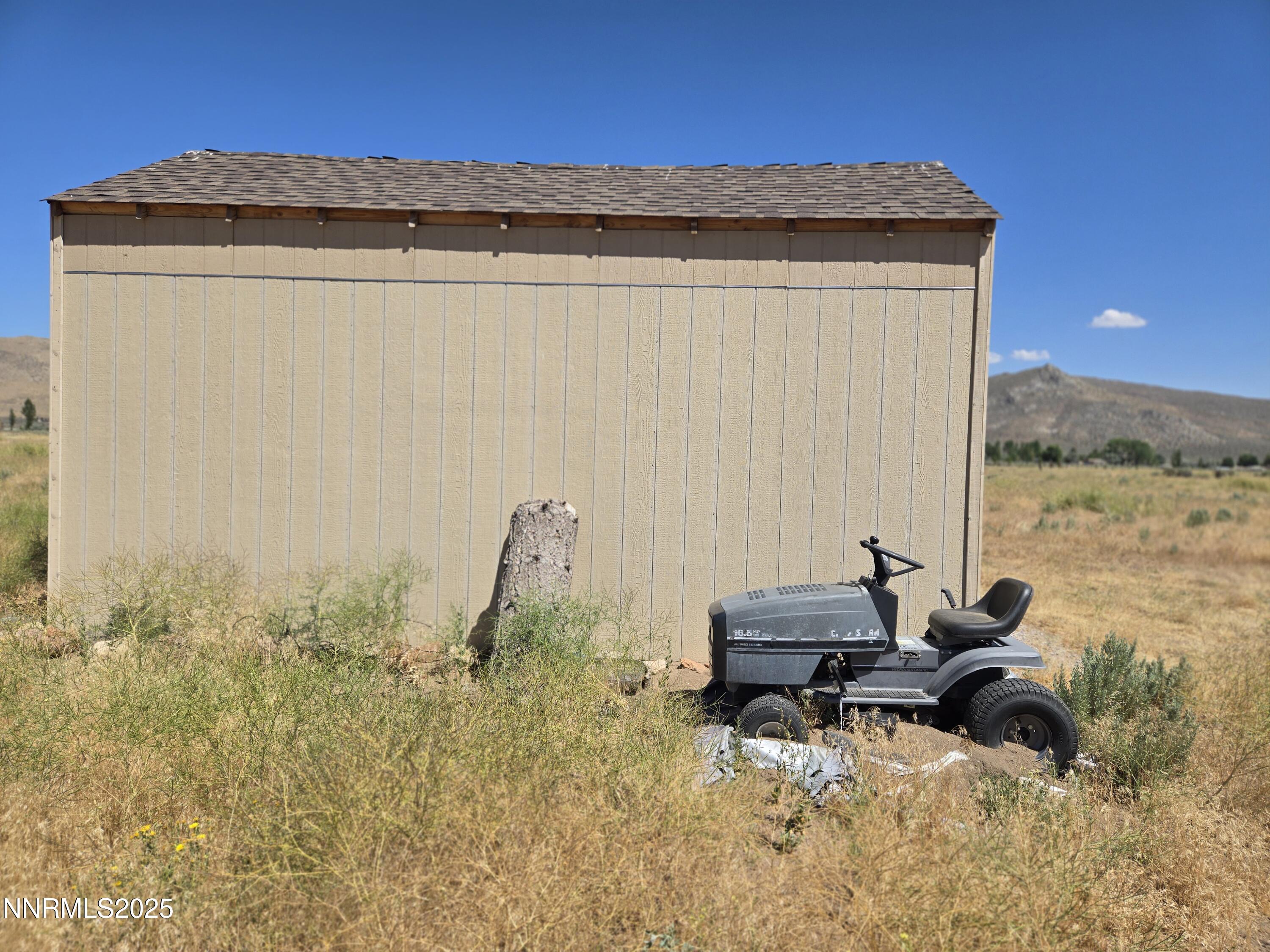 40 Cowhide Circle Reno, NV 89508 - Photo 16 of 19 a backyard of a house with table and chairs