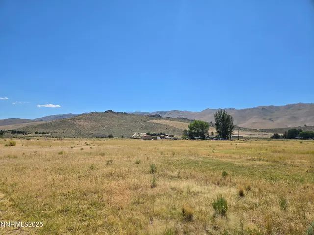 a view of an ocean beach and mountain
