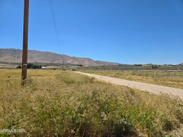 a view of an ocean with a mountain