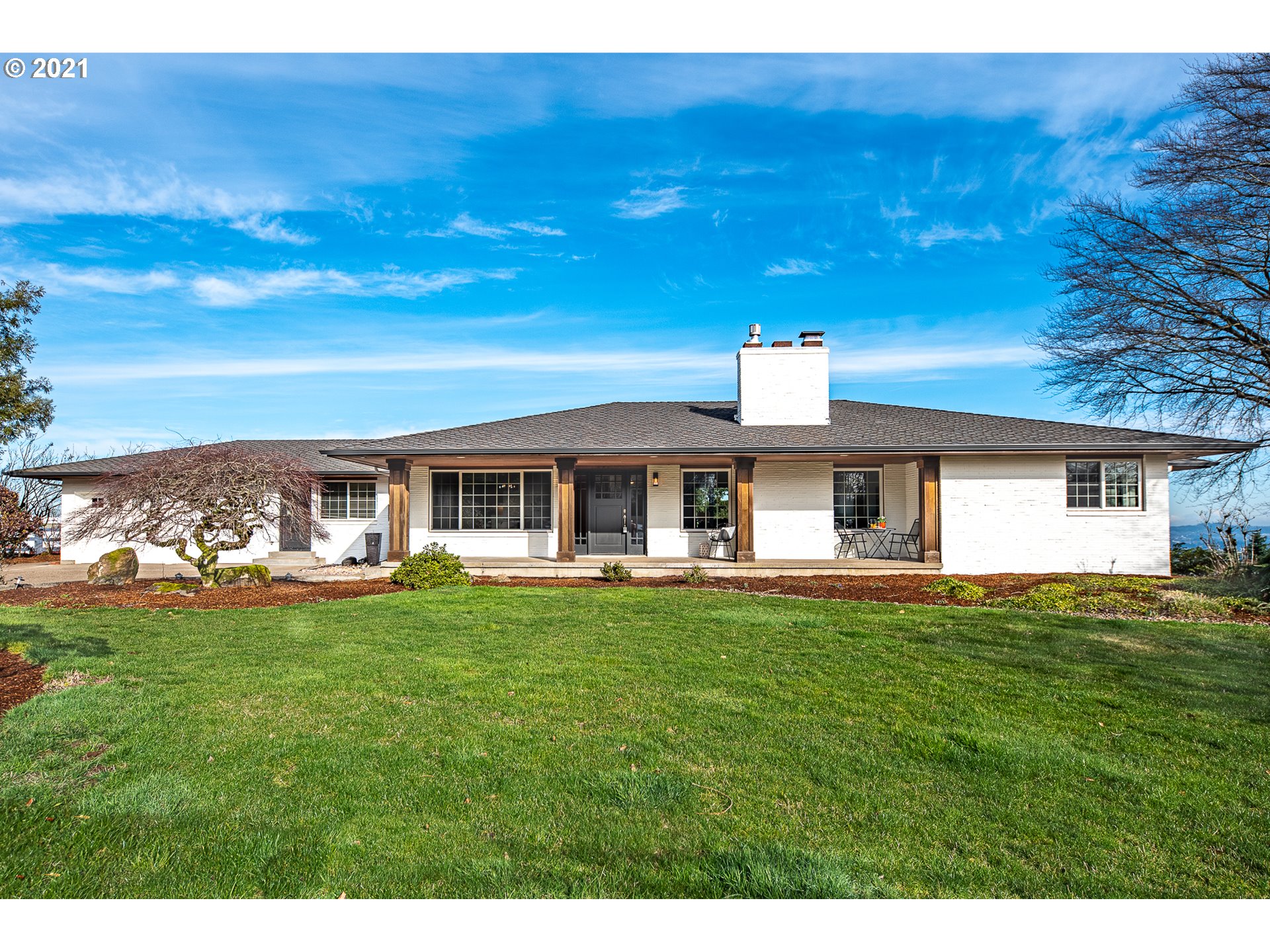 16675 Southwest Parrett Mountain Road Sherwood, OR 97140 - Photo 1 of 31 a front view of a house with a garden