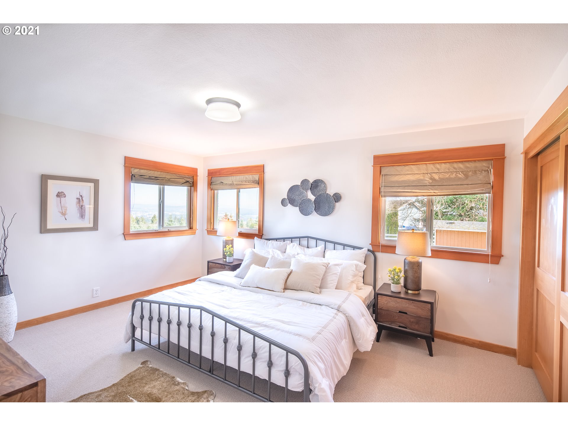 16675 Southwest Parrett Mountain Road Sherwood, OR 97140 - Photo 10 of 31 a bedroom with a bed and a window