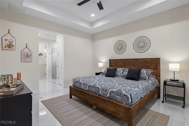 a bedroom with a large bed and a table