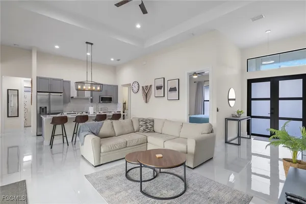 a living room with furniture and a large window