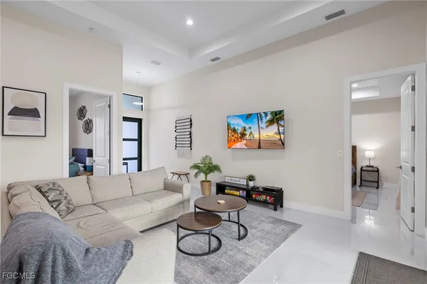 a living room with furniture and a table