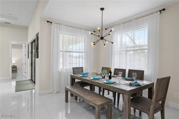 a view of a dining room with furniture window and outside view
