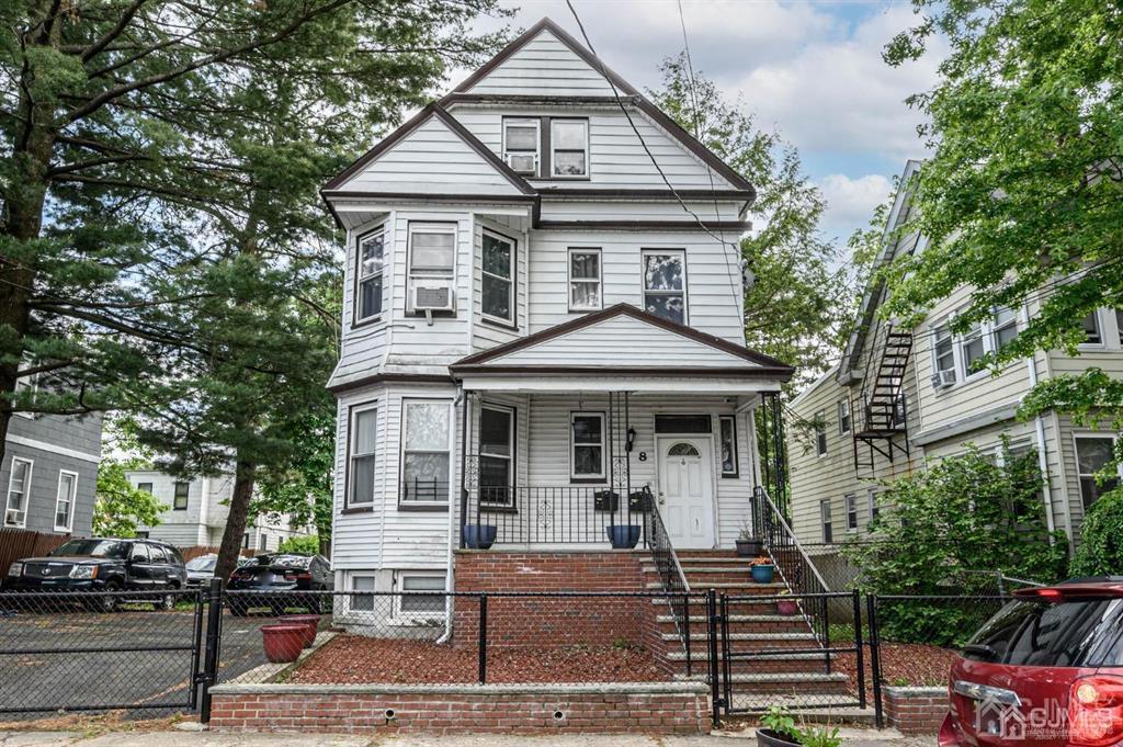 8 Ricord Street Newark, NJ 07106 - Photo 1 of 39 a front view of a house with garden