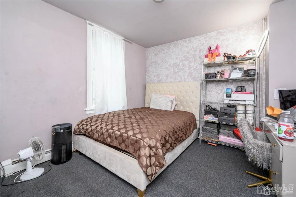 8 Ricord Street Newark, NJ 07106 - Photo 16 of 39 a bedroom with a bed and a window