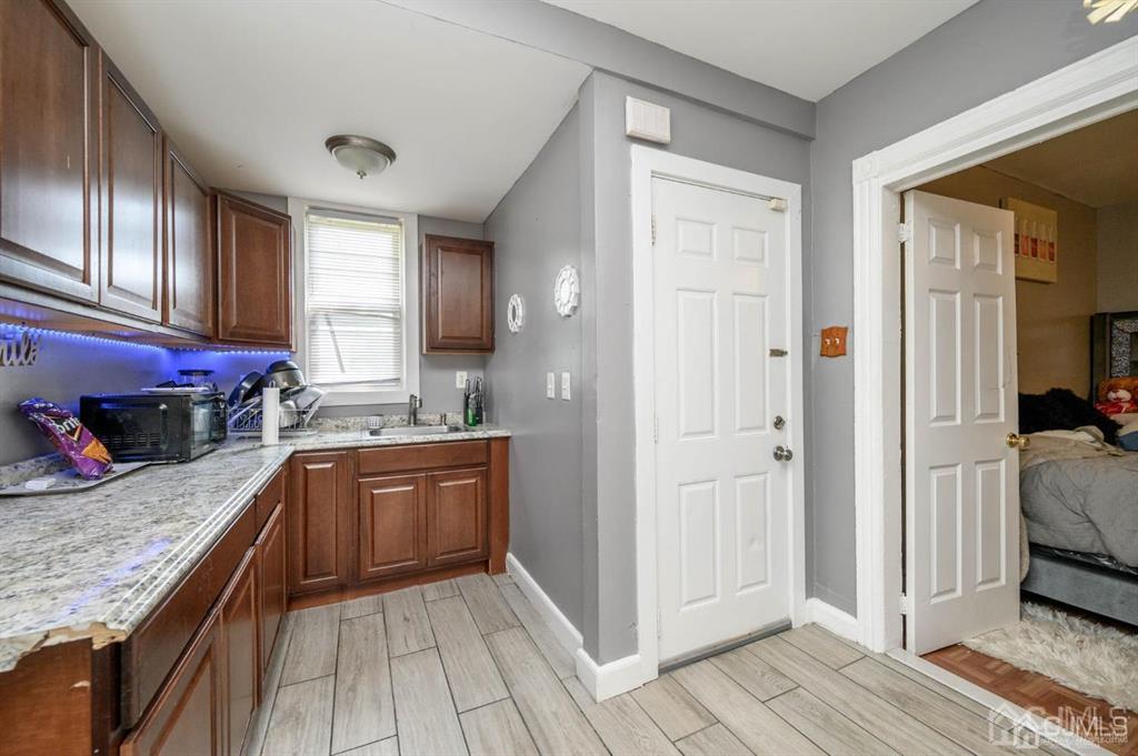 8 Ricord Street Newark, NJ 07106 - Photo 23 of 39 a kitchen with a refrigerator and a sink